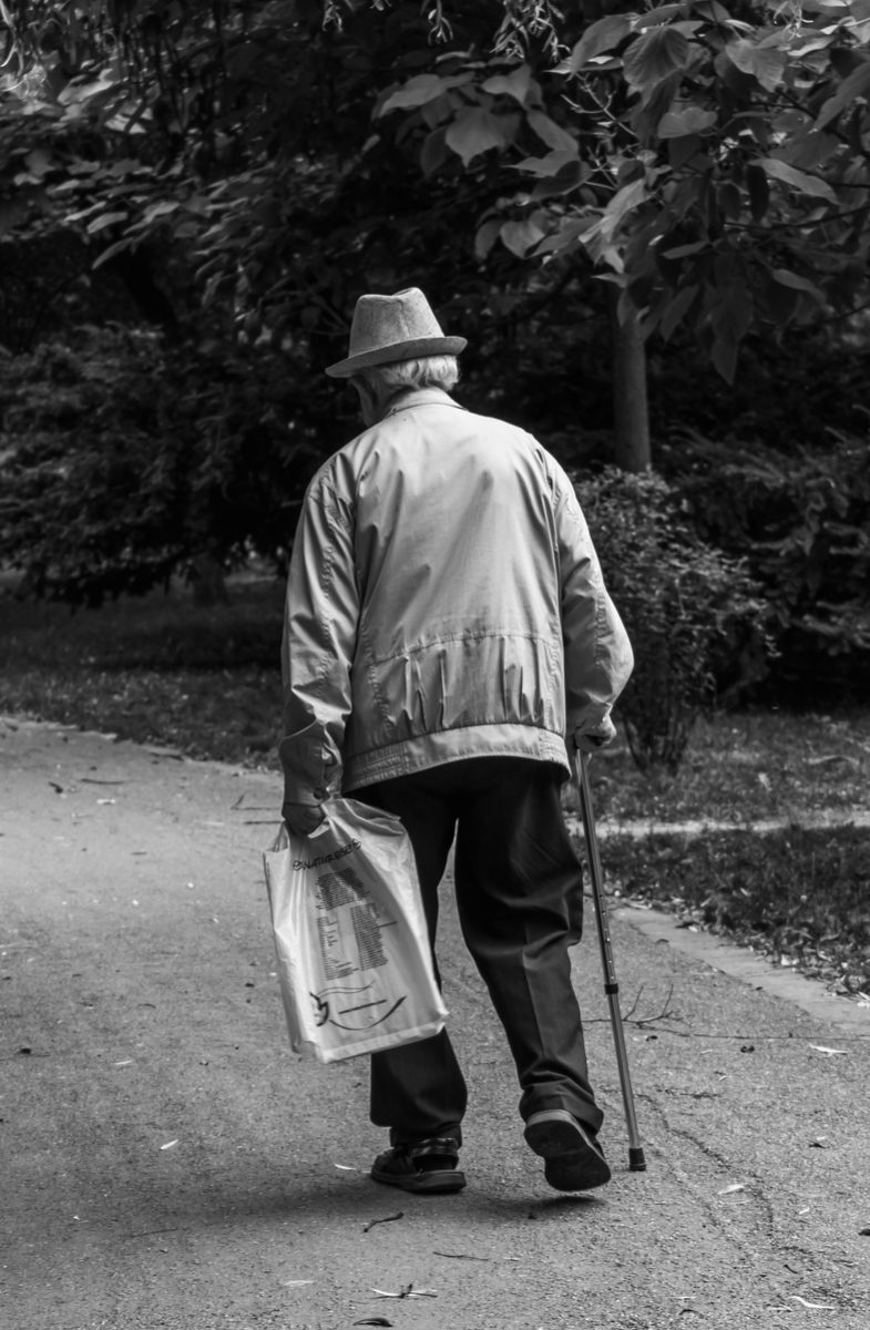 old man walking away